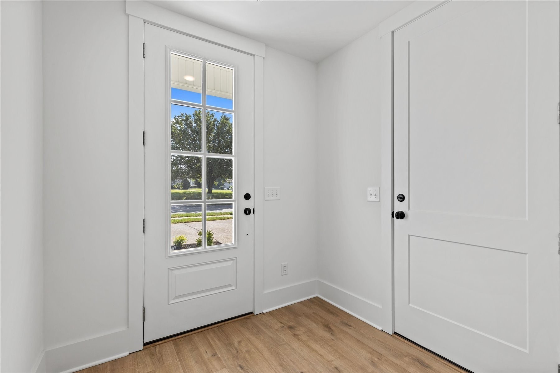 321 Old Shackle Island Road Hendersonville, TN 37075 - Photo 7 of 49 a view of an empty room with wooden floor and a window