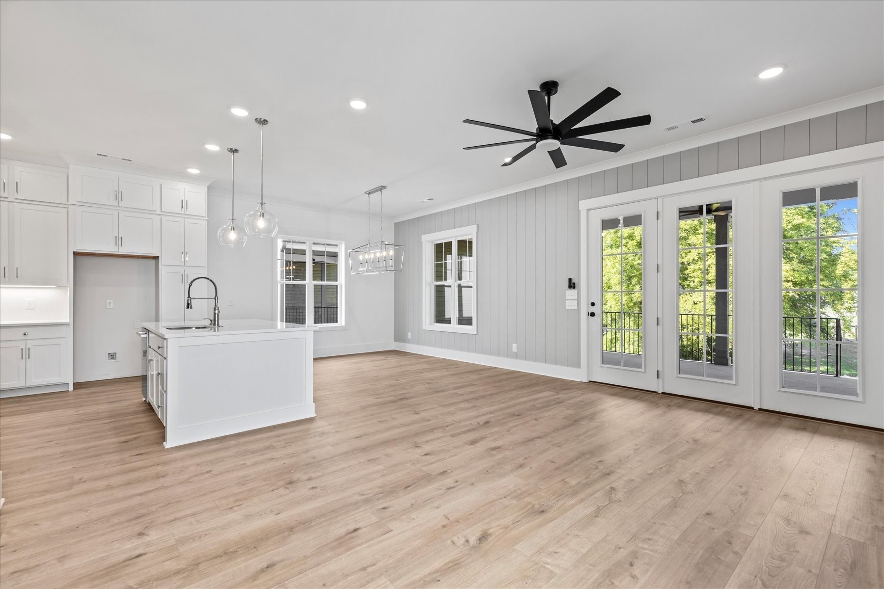 321 Old Shackle Island Road Hendersonville, TN 37075 - Photo 9 of 49 a view of an empty room with a window and wooden floor
