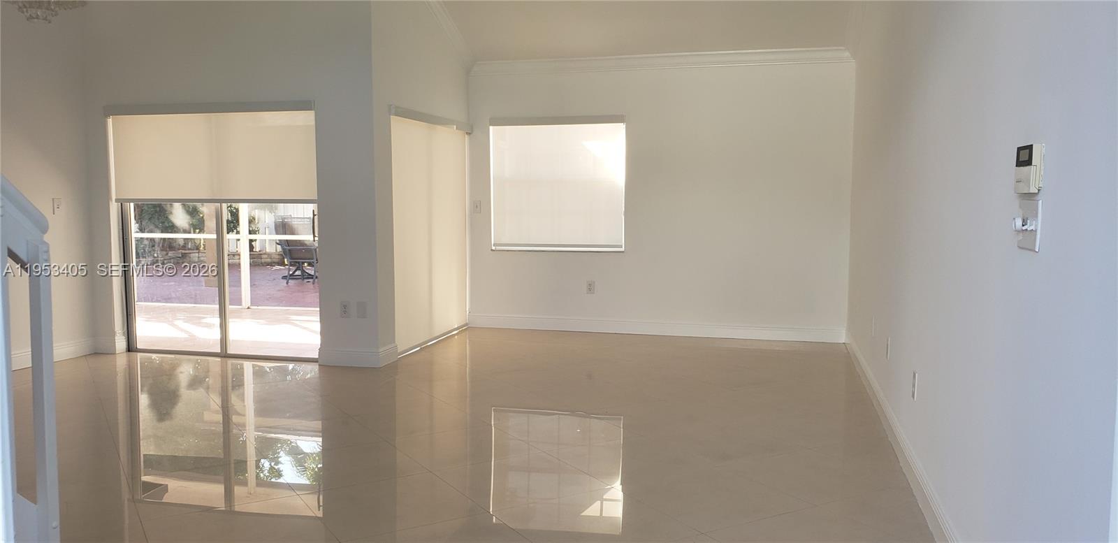 11242 Southwest 62nd Lane, Unit 11242 Miami, FL 33173 - Photo 2 of 58 a view of an empty room with a window