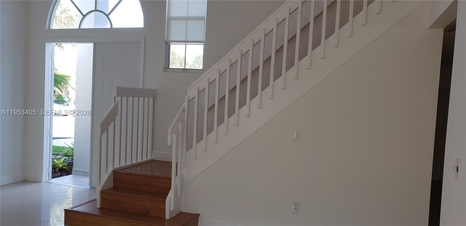 11242 Southwest 62nd Lane, Unit 11242 Miami, FL 33173 - Photo 3 of 58 a view of entryway with wooden floor and windows