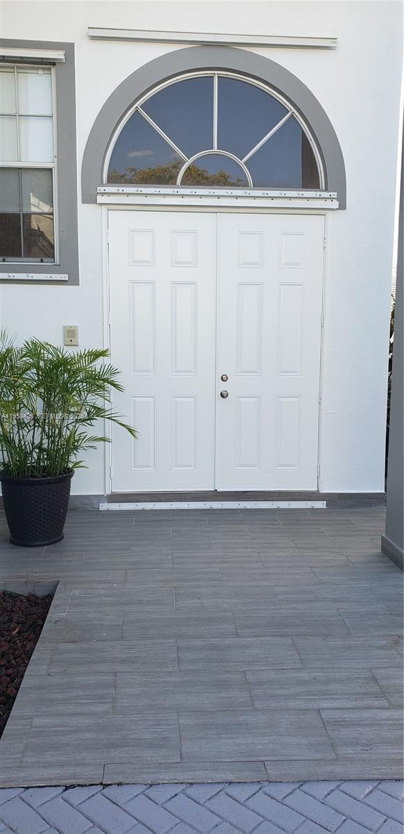 11242 Southwest 62nd Lane, Unit 11242 Miami, FL 33173 - Photo 51 of 58 a view of front door of house