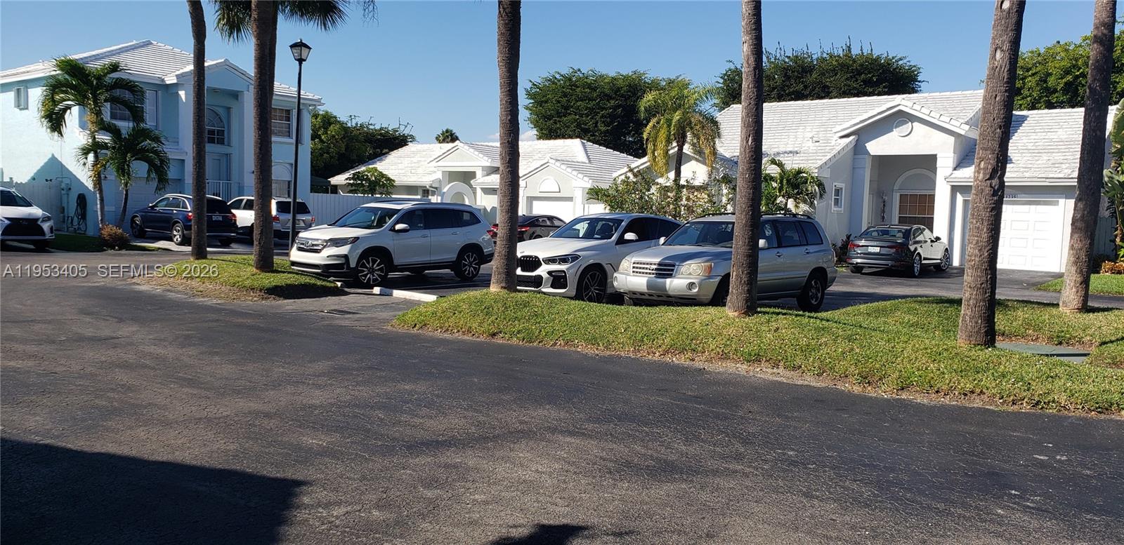 11242 Southwest 62nd Lane, Unit 11242 Miami, FL 33173 - Photo 56 of 58 a view of yard with cars parked