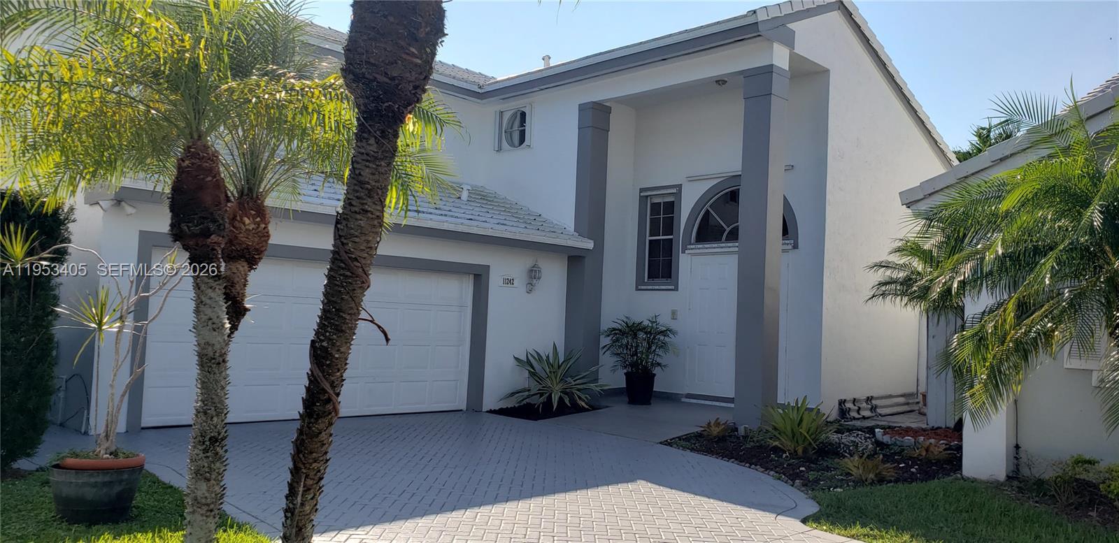 11242 Southwest 62nd Lane, Unit 11242 Miami, FL 33173 - Photo 58 of 58 a house view with a garden space