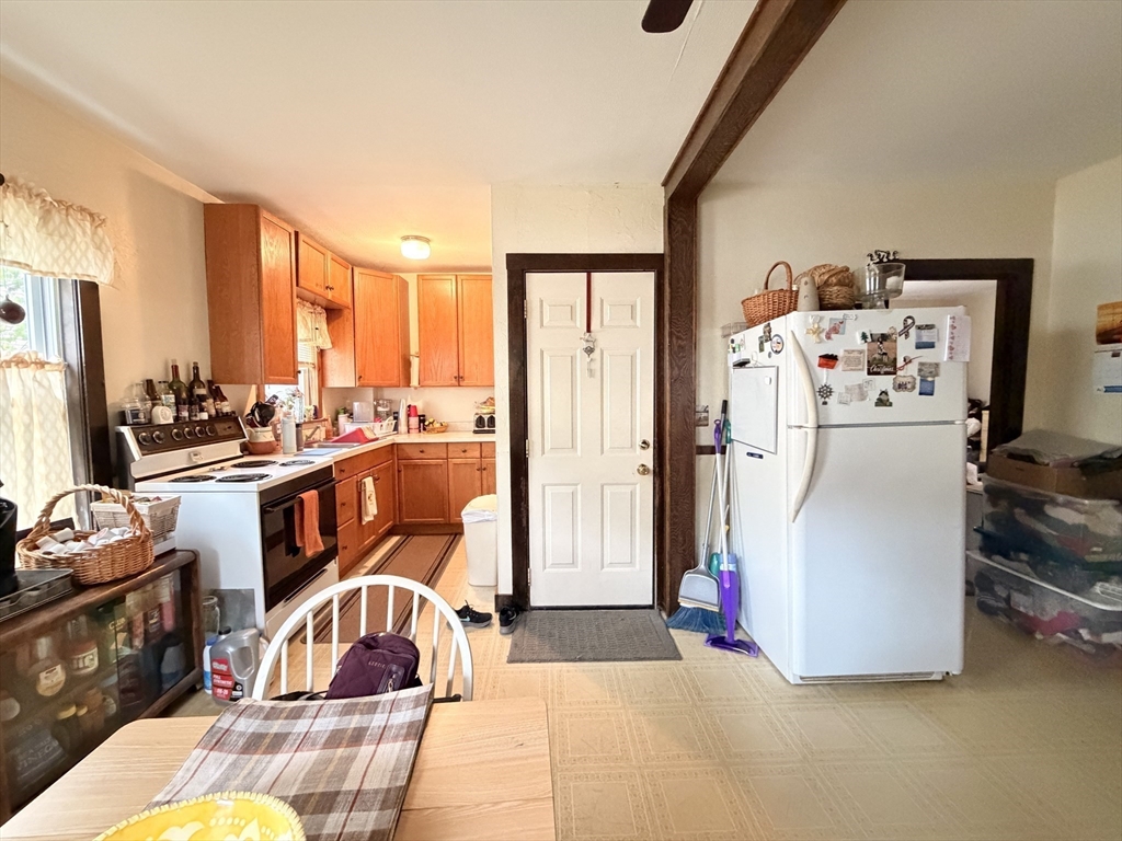 12 Whitcomb Street Webster, MA 01570 - Photo 31 of 40 a living room with furniture a large window with kitchen view