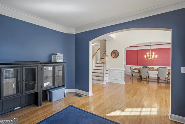 a view of a dining room with furniture window and wooden floor