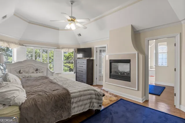 a bathroom with a sink vanity granite tub and a mirror