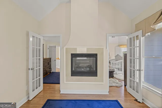 a bathroom with a sink a toilet a mirror and shower