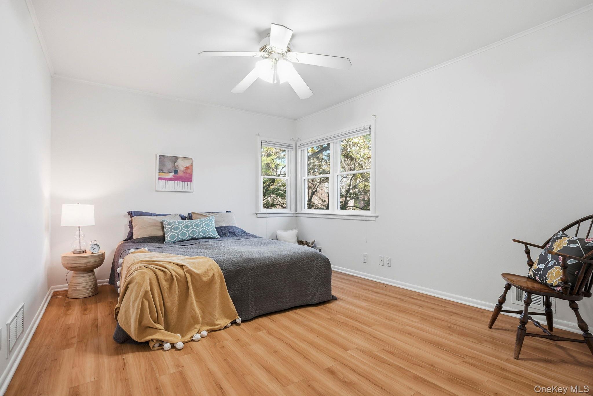 20 Highview Road Ossining, NY 10562 - Photo 15 of 28 Bedroom featuring ornamental molding, light wood-style floors, and a ceiling fan