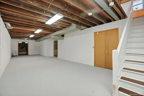a view of empty room with wooden ceiling
