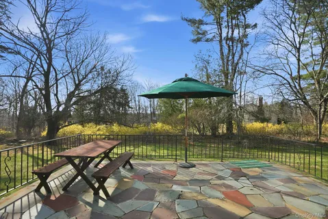 a patio with table and chairs