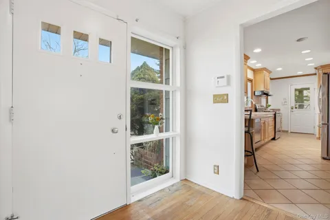 a view of a kitchen with a refrigerator cabinets and a window