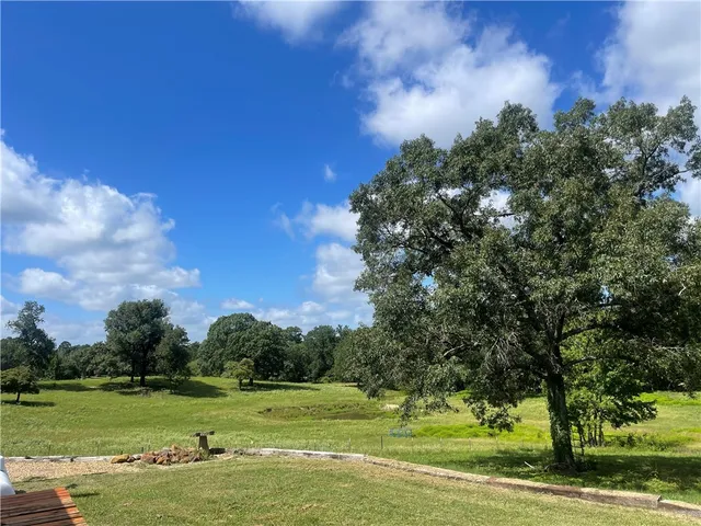 a view of a golf course with a lake
