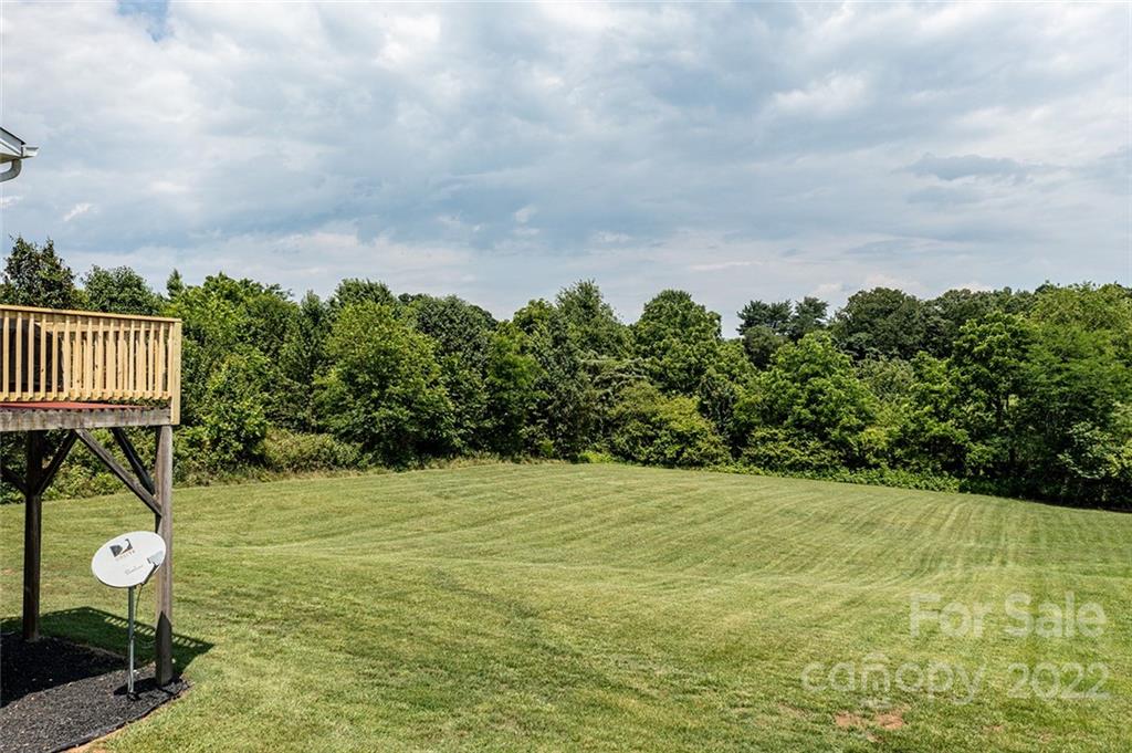 4226 Hickory Nut Ridge Road Hudson, NC 28638 - Photo 7 of 20 a view of a swimming pool with an outdoor space and seating area
