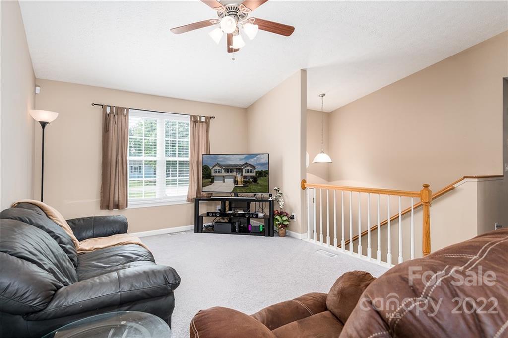 4226 Hickory Nut Ridge Road Hudson, NC 28638 - Photo 9 of 20 a living room with furniture and a flat screen tv