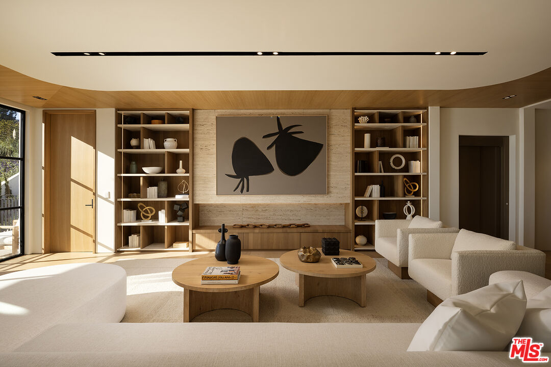 1165 Somera Road Los Angeles, CA 90077 - Photo 16 of 44 a living room with furniture and window