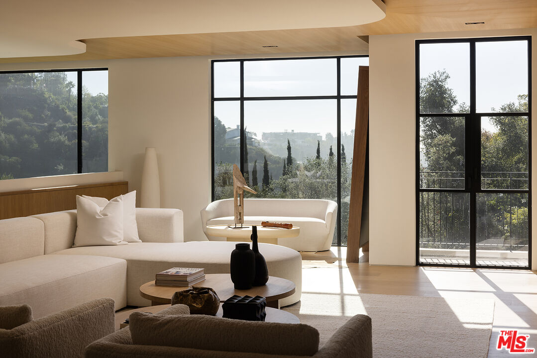 1165 Somera Road Los Angeles, CA 90077 - Photo 17 of 44 a living room with furniture and a large window