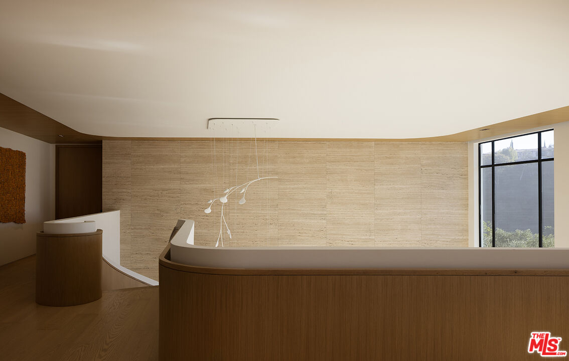 1165 Somera Road Los Angeles, CA 90077 - Photo 26 of 44 a view of a chair and table in a lake