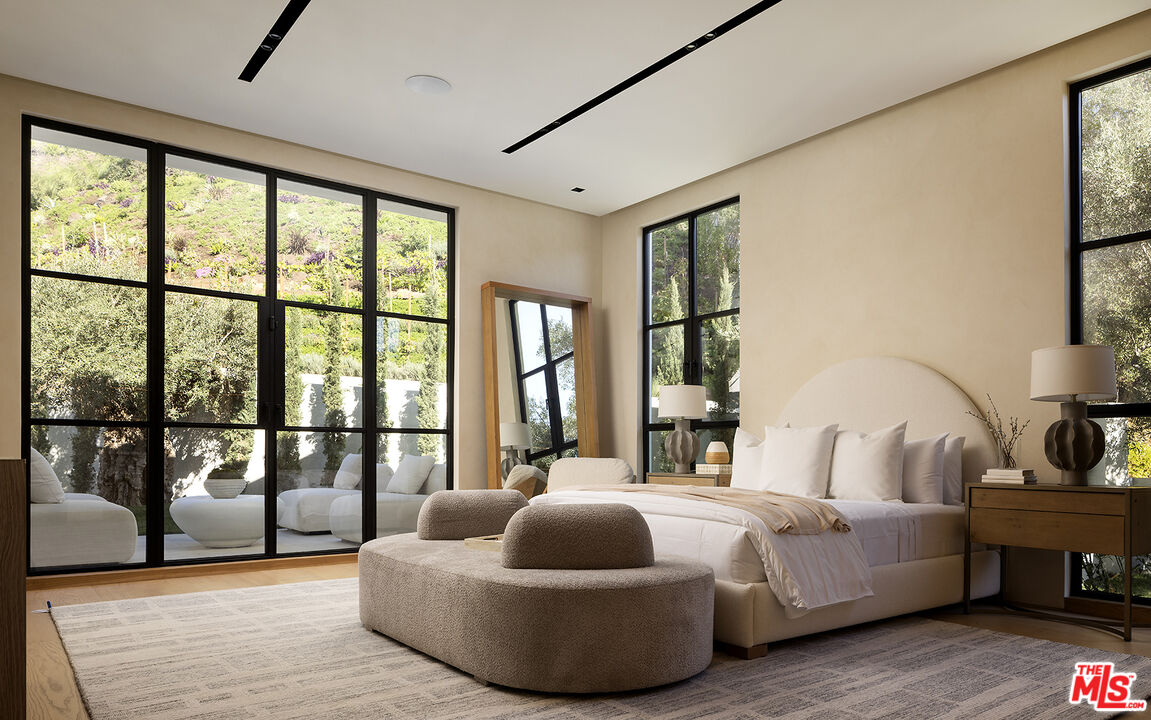 1165 Somera Road Los Angeles, CA 90077 - Photo 29 of 44 a bedroom with furniture and a large window