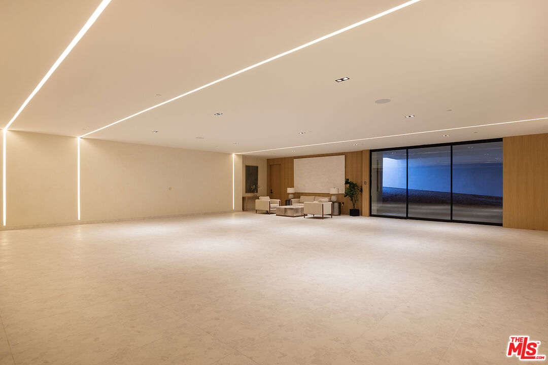 1165 Somera Road Los Angeles, CA 90077 - Photo 40 of 44 a view of empty room with a ceiling fan
