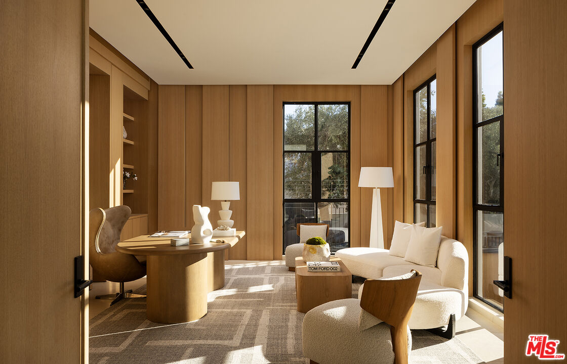 1165 Somera Road Los Angeles, CA 90077 - Photo 4 of 44 a living room with fireplace furniture and a large window