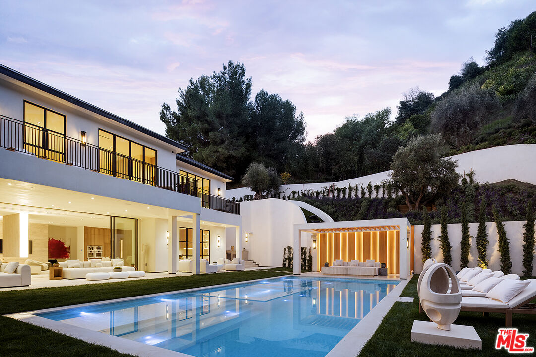 1165 Somera Road Los Angeles, CA 90077 - Photo 42 of 44 a view of a house with pool and deck