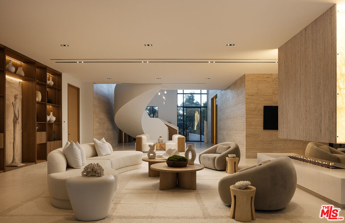 1165 Somera Road Los Angeles, CA 90077 - Photo 7 of 44 a living room with furniture and wooden floor