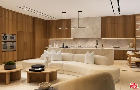 a living room with furniture and a painting