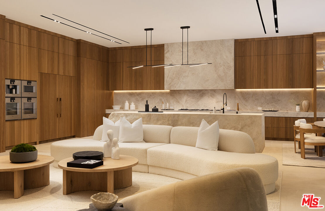 1165 Somera Road Los Angeles, CA 90077 - Photo 10 of 44 a living room with furniture and a painting