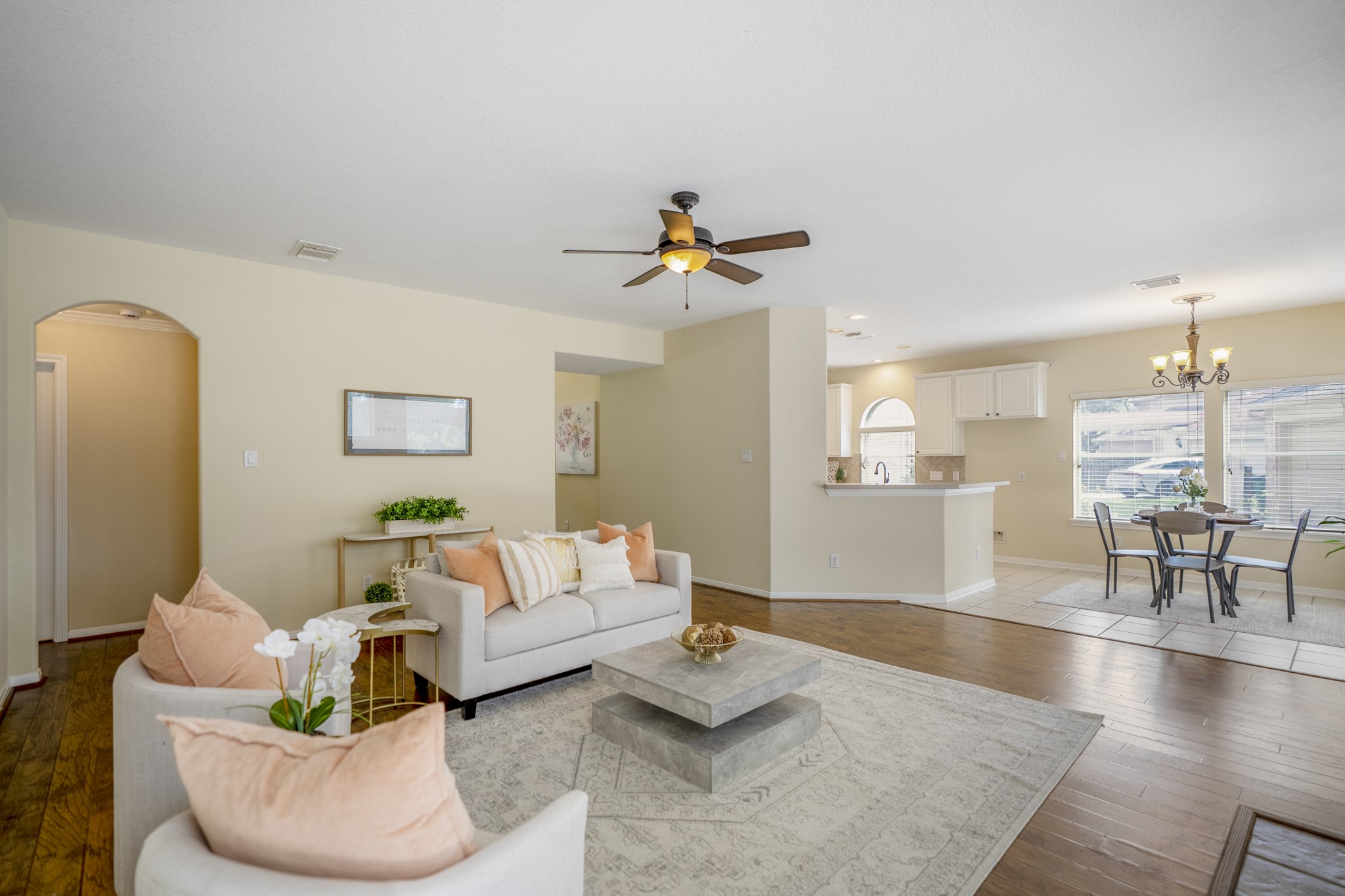 5807 Sequoia Trace Court Spring, TX 77379 - Photo 9 of 50 The main living area opens wide to the breakfast nook and kitchen, creating an easy everyday flow with plenty of room to gather before heading out back to the pool, spa, and golf course views.