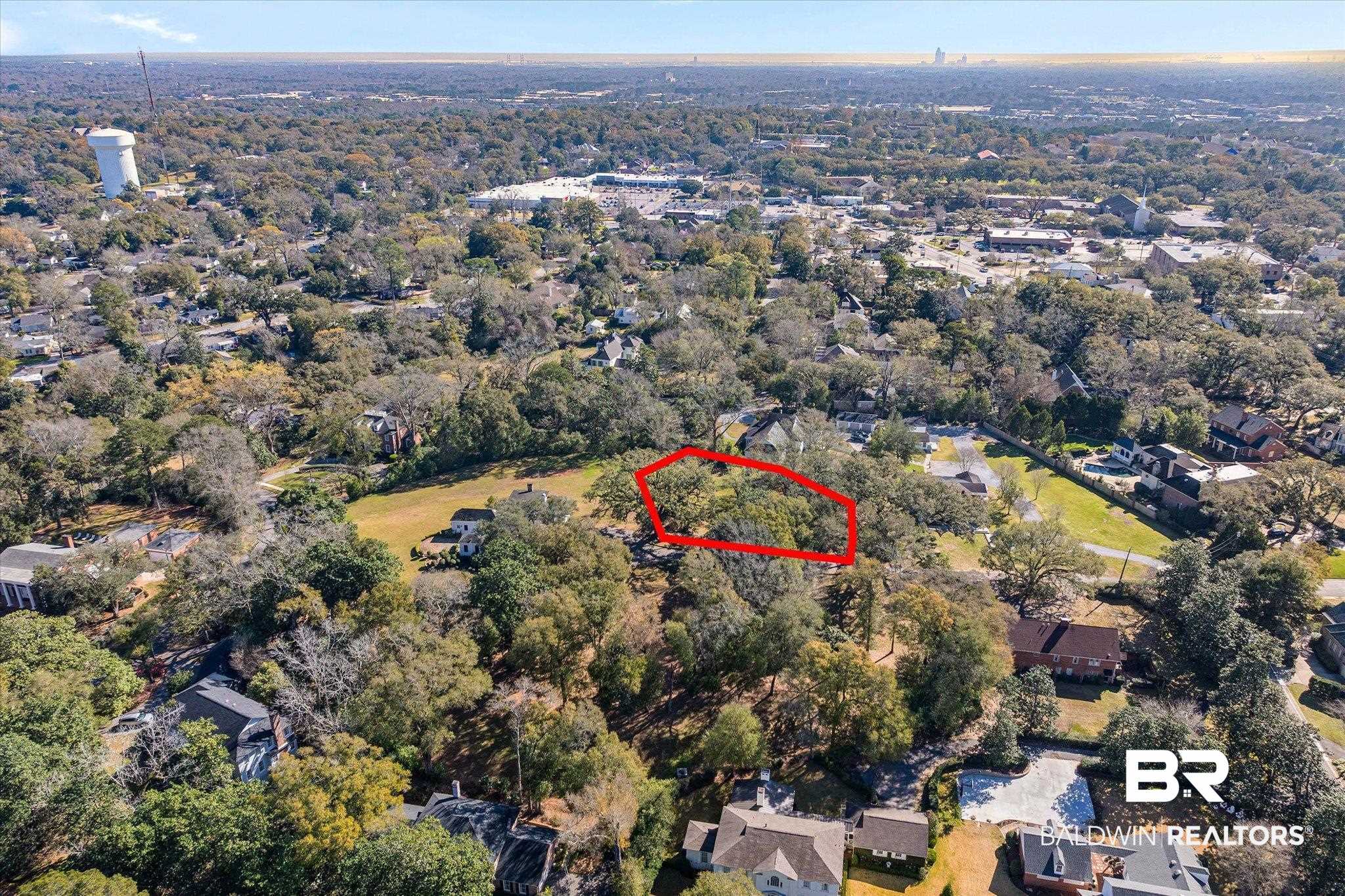 0 Austill Place Mobile, AL 36608 - Photo 6 of 14 Aerial view of property's location with nearby suburban area and property parcel outlined