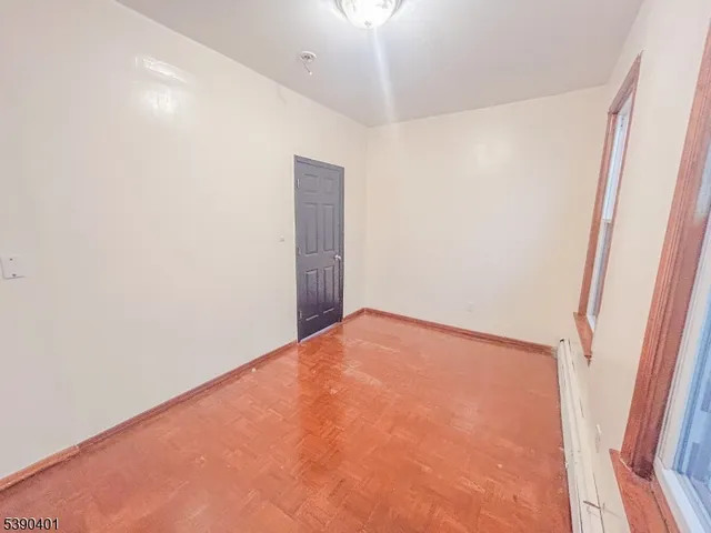 an empty room with a ceiling fan