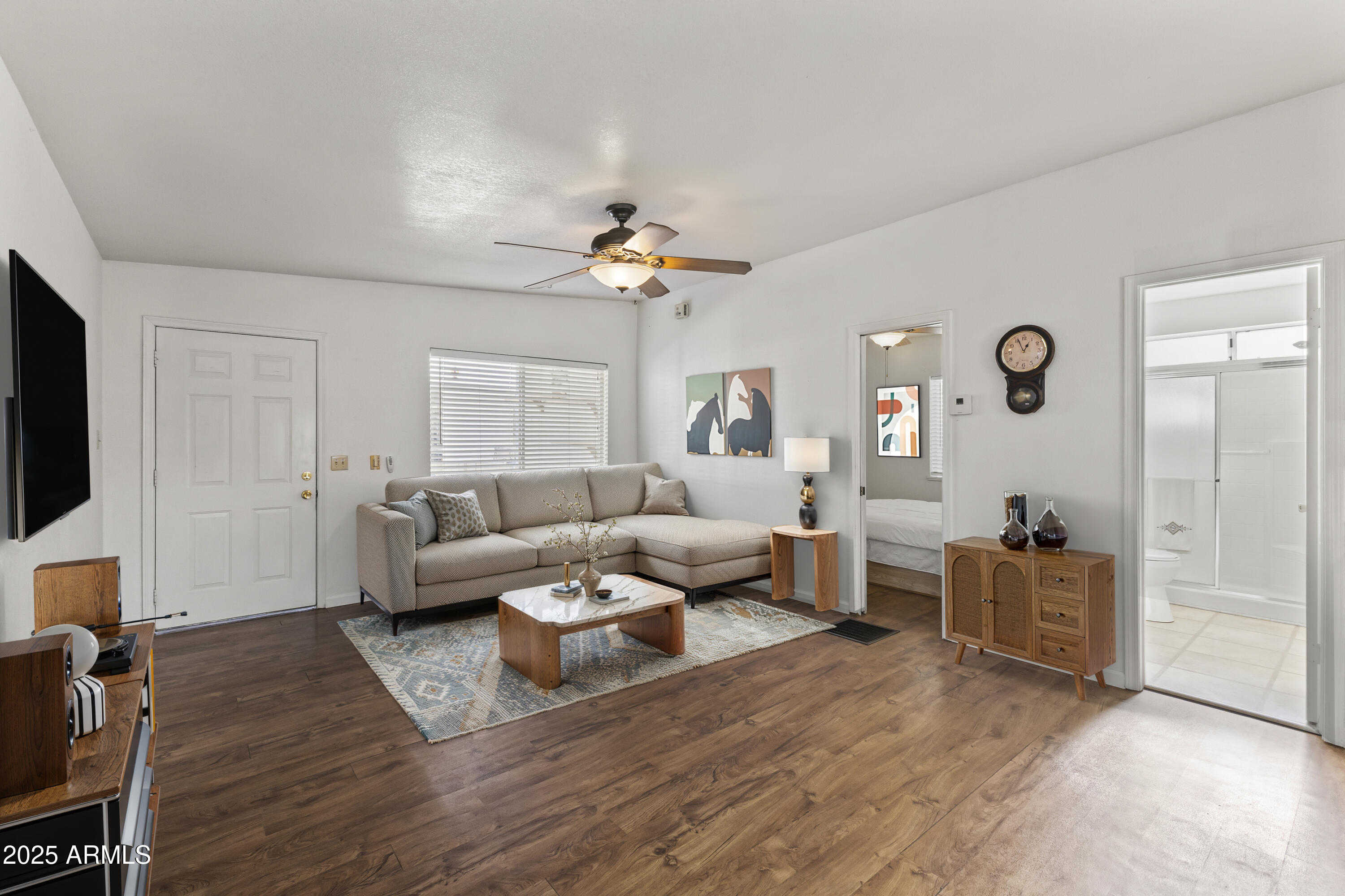 17200 West Bell Road, Unit 771 Surprise, AZ 85374 - Photo 13 of 37 a living room with furniture and a flat screen tv