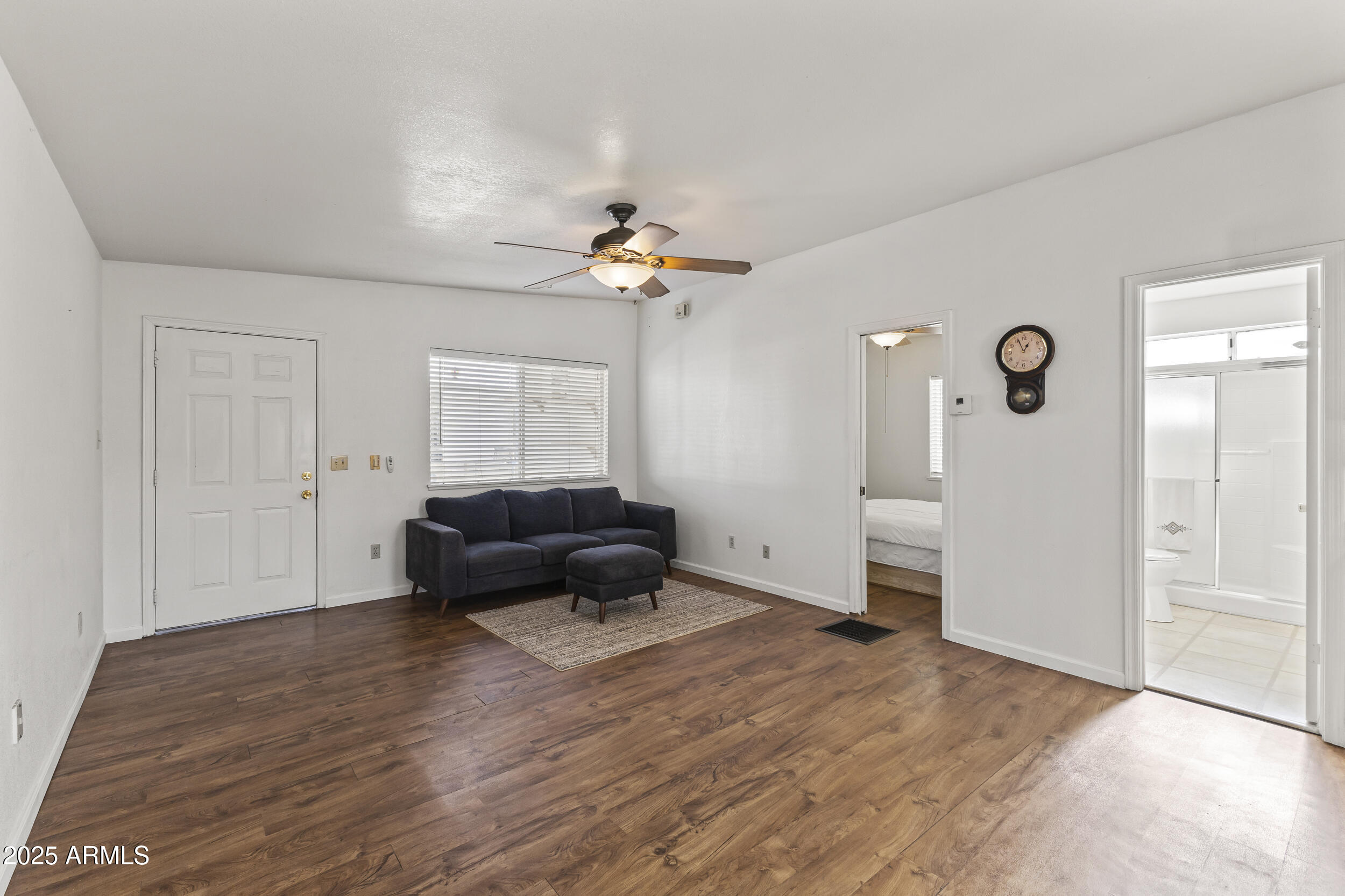 17200 West Bell Road, Unit 771 Surprise, AZ 85374 - Photo 14 of 37 a living room with furniture and a chandelier