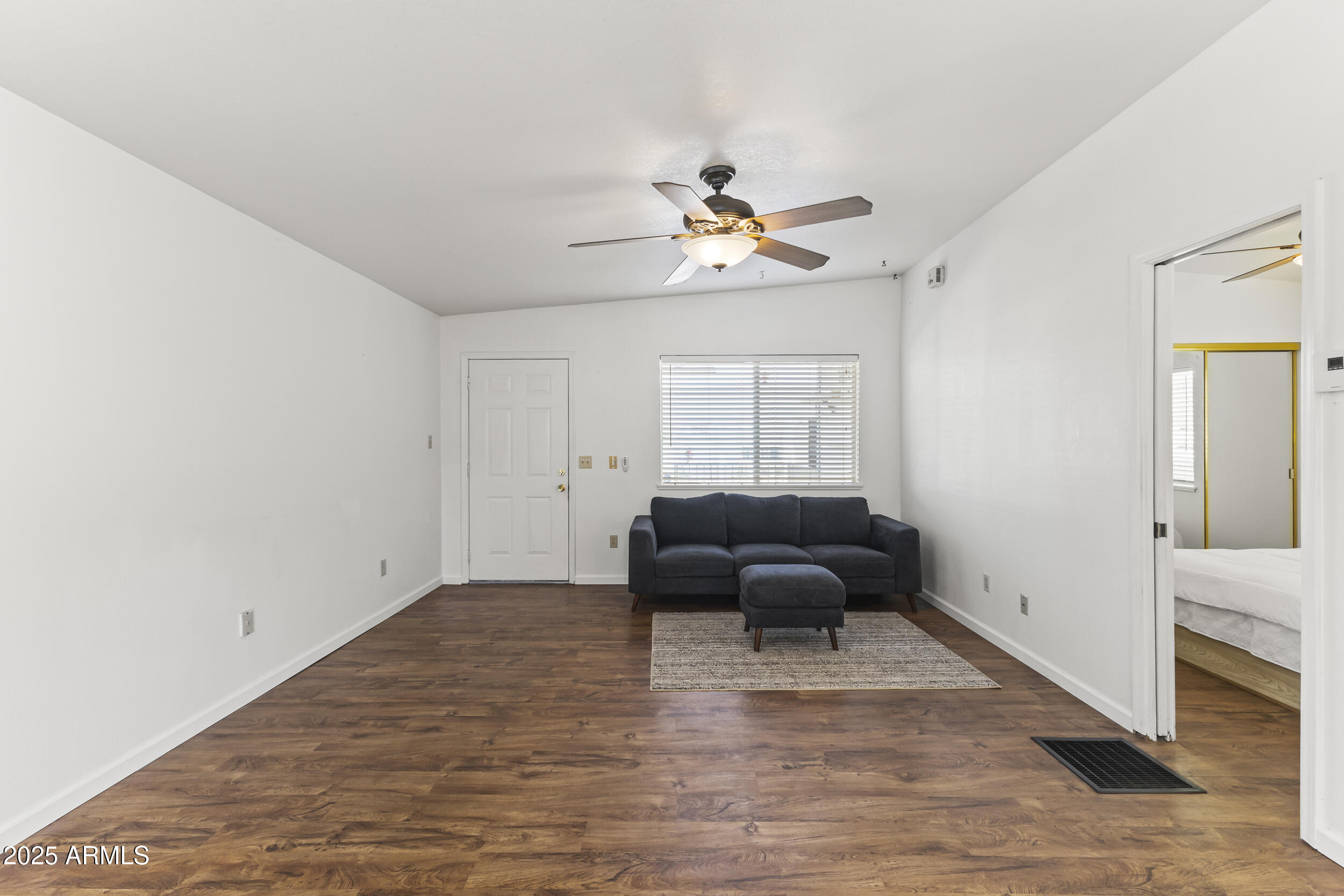 17200 West Bell Road, Unit 771 Surprise, AZ 85374 - Photo 17 of 37 a living room with furniture and a wooden floor