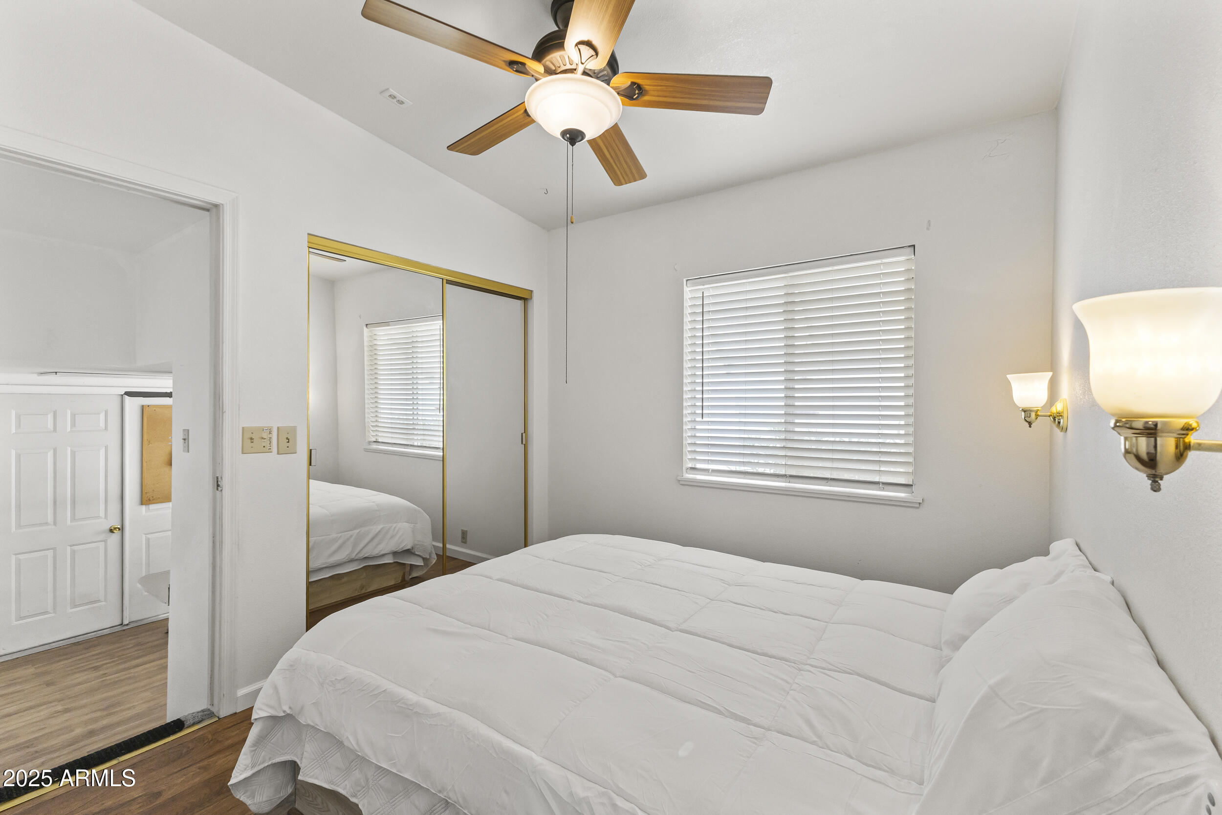 17200 West Bell Road, Unit 771 Surprise, AZ 85374 - Photo 25 of 37 a bedroom with a bed and a window