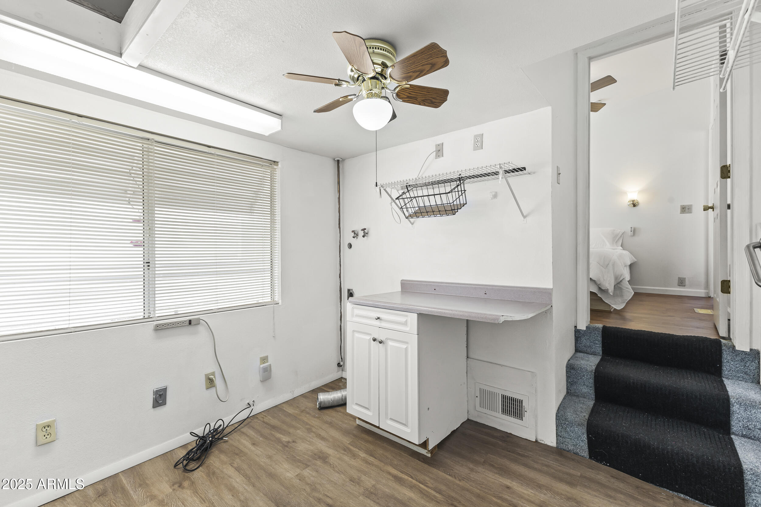17200 West Bell Road, Unit 771 Surprise, AZ 85374 - Photo 27 of 37 a view of cabinets and wooden floor