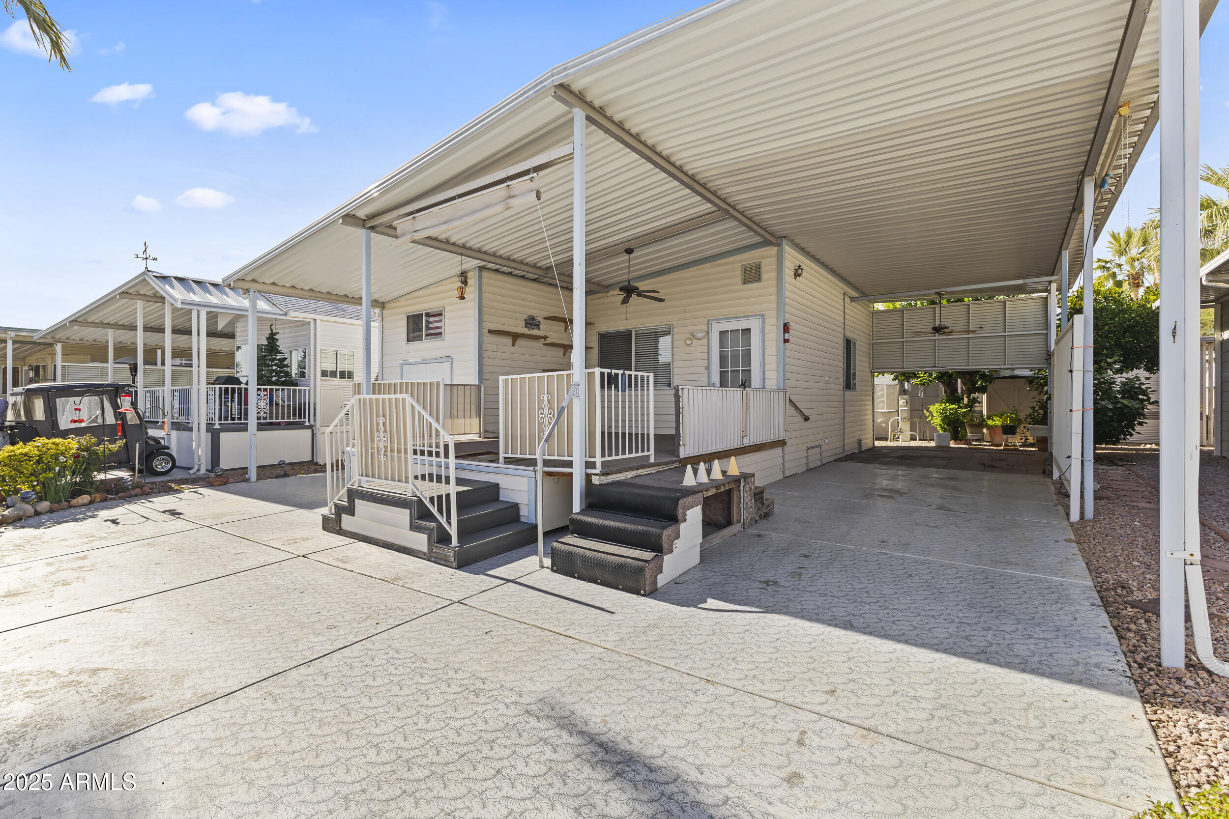 17200 West Bell Road, Unit 771 Surprise, AZ 85374 - Photo 2 of 37 a view of a house with backyard and sitting area