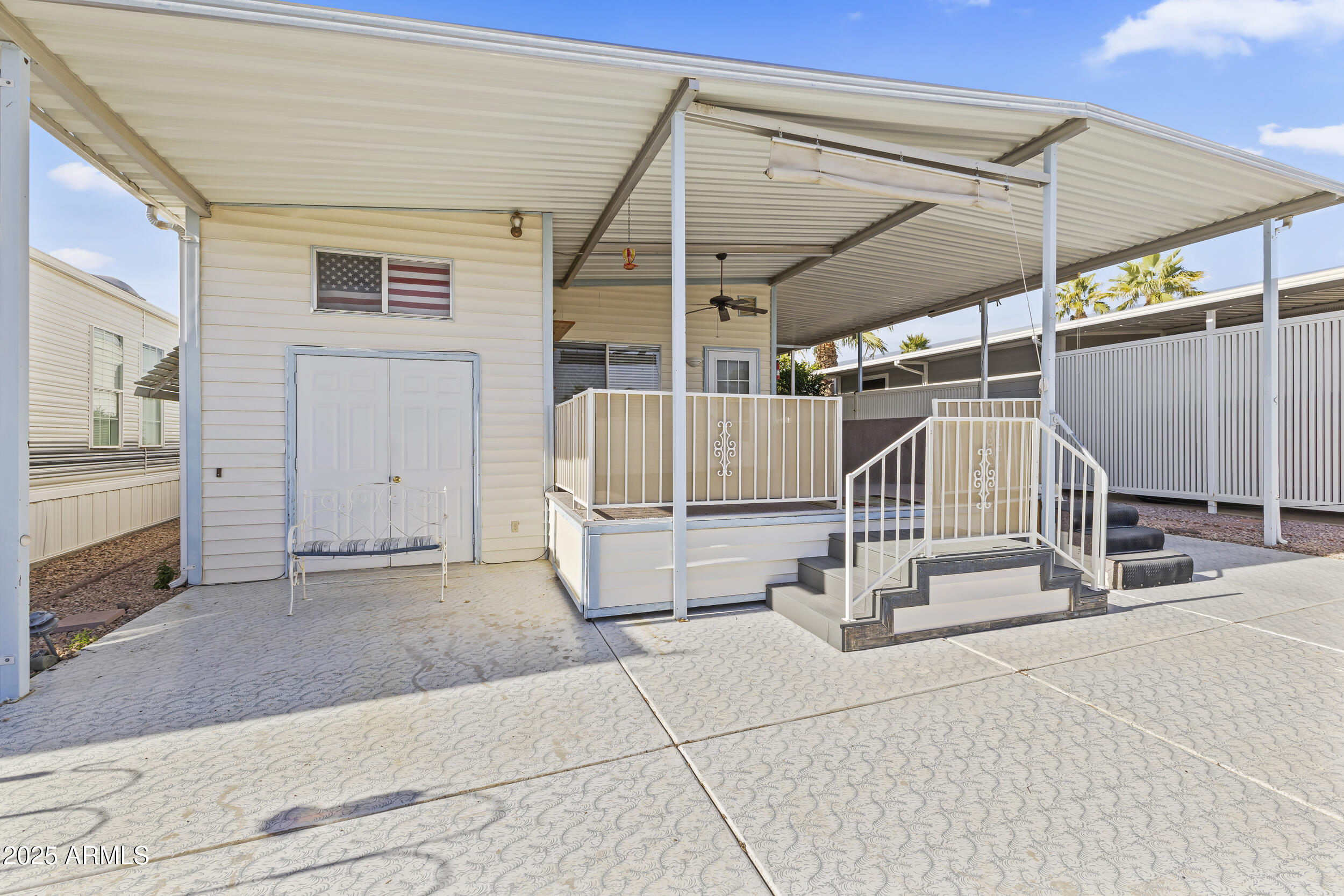 17200 West Bell Road, Unit 771 Surprise, AZ 85374 - Photo 4 of 37 a view of a patio with table and chairs