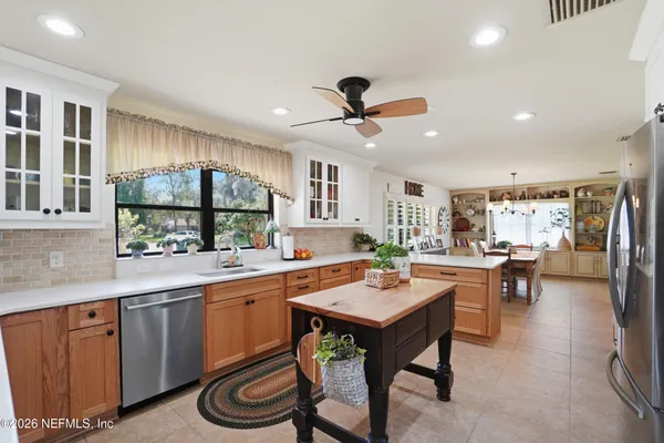 a dining room with furniture and window