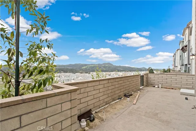 a balcony with view of living room