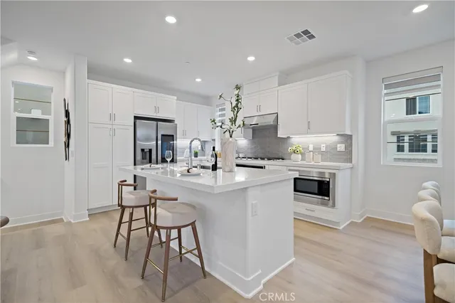 a kitchen with furniture and a table