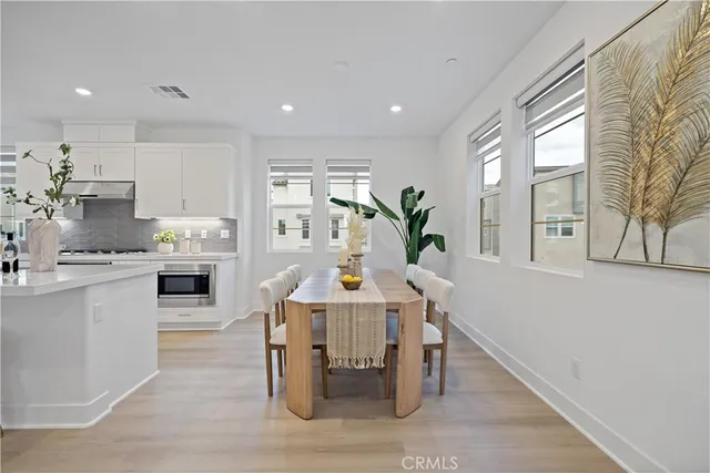 a kitchen with a table and chairs in it