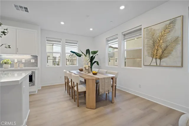 a kitchen with refrigerator a sink and cabinets