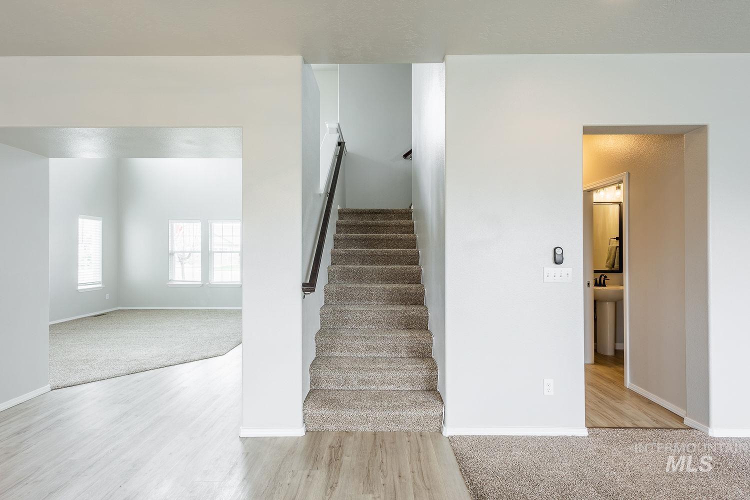 2515 Fallcrest Street Caldwell, ID 83607 - Photo 22 of 48 Stairs with carpet and wood finished floors