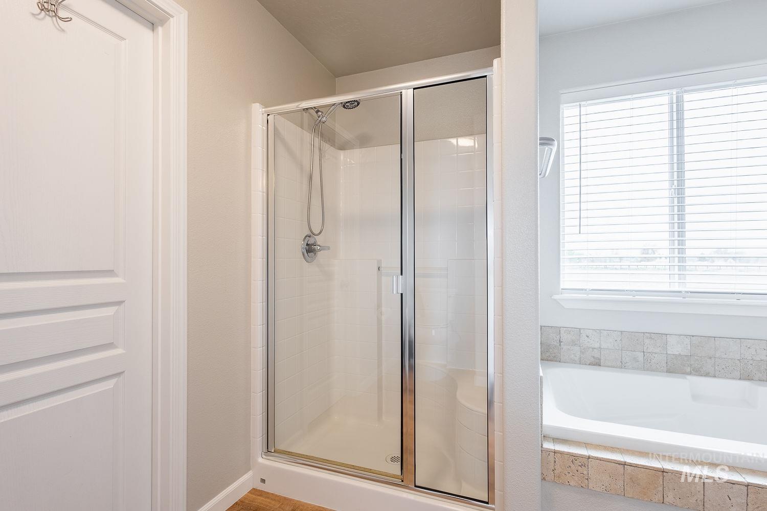 2515 Fallcrest Street Caldwell, ID 83607 - Photo 29 of 48 Bathroom featuring a garden tub and a shower stall