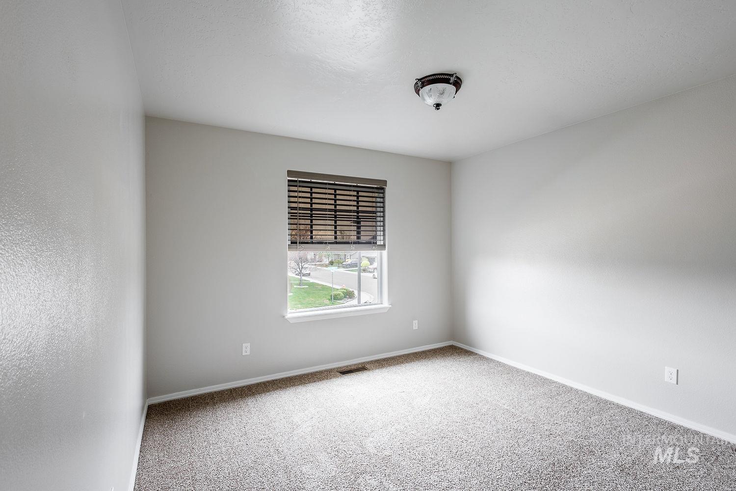 2515 Fallcrest Street Caldwell, ID 83607 - Photo 36 of 48 Empty room with light carpet and baseboards