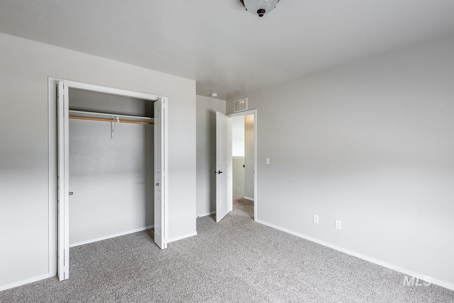 2515 Fallcrest Street Caldwell, ID 83607 - Photo 37 of 48 Unfurnished bedroom with light carpet and a closet