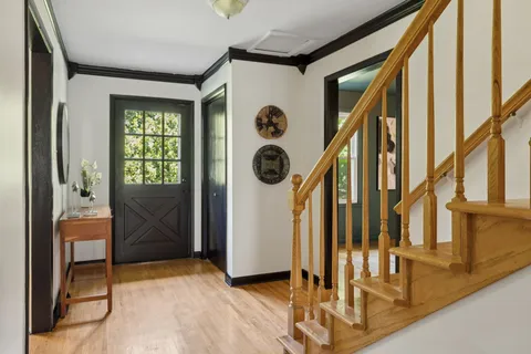 a bedroom with double bed and a chandelier