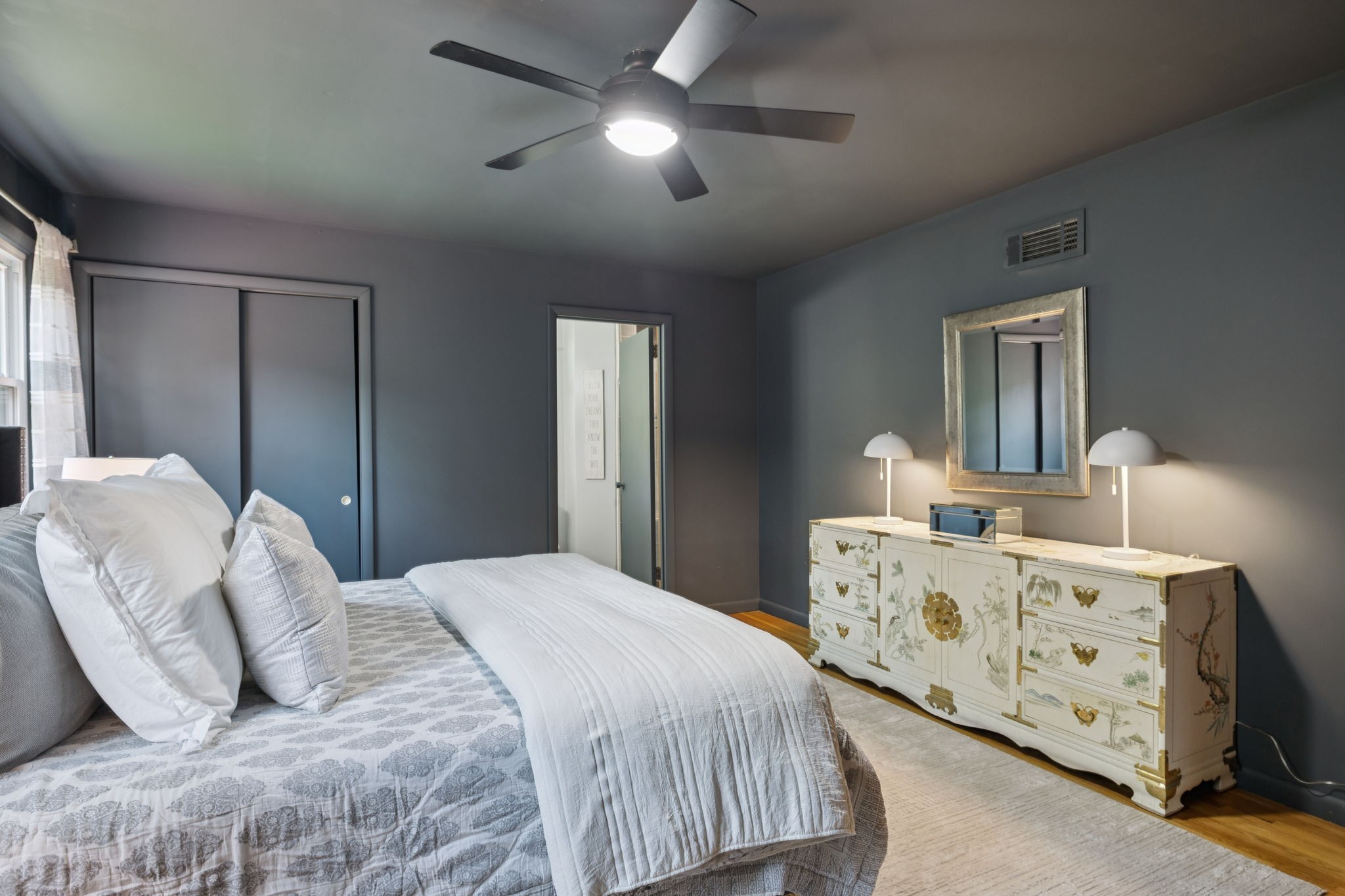 7199 Harper Road Joelton, TN 37080 - Photo 26 of 56 a bedroom with double bed and a chandelier