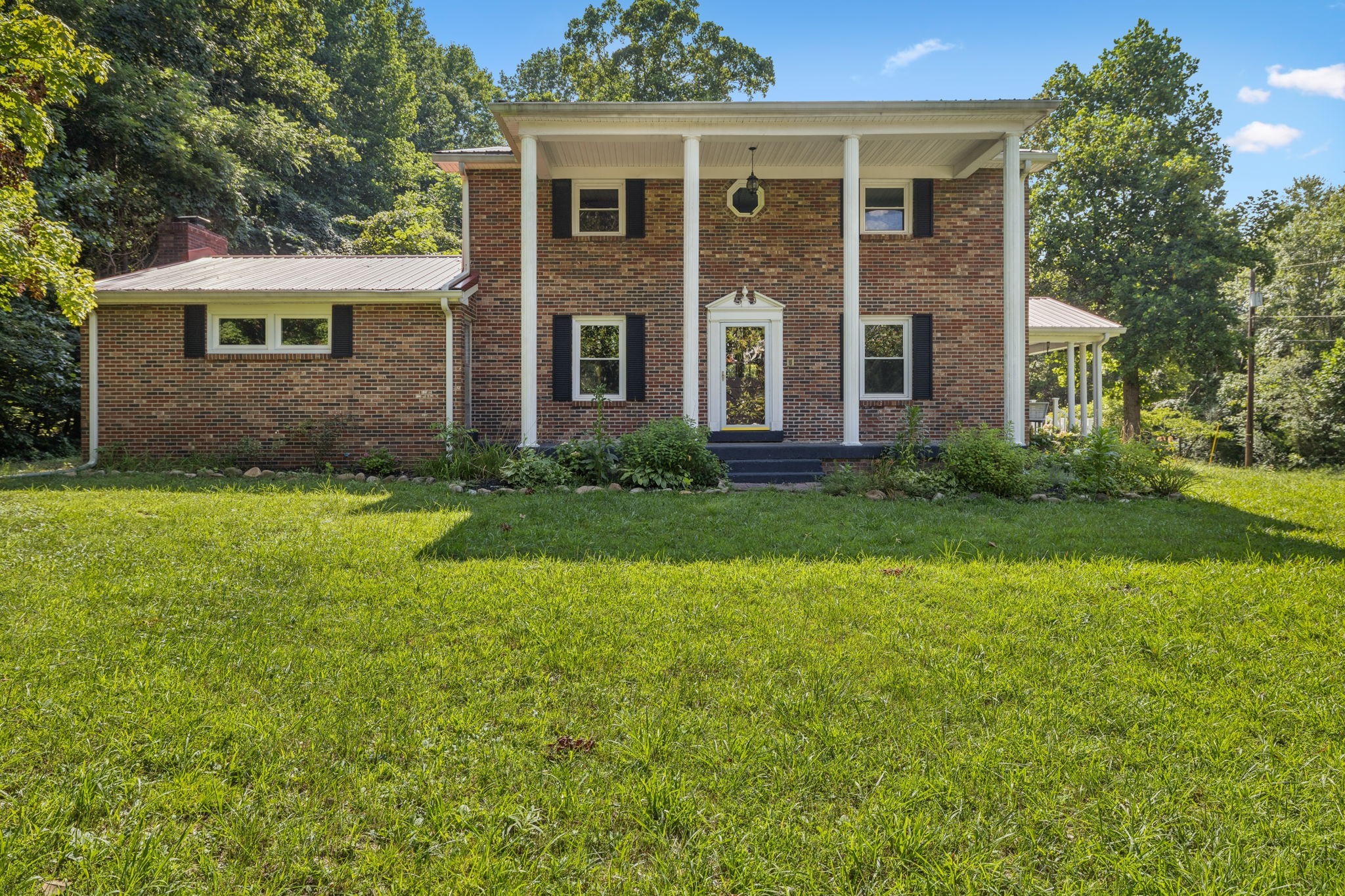 7199 Harper Road Joelton, TN 37080 - Photo 4 of 56 a view of a house with a yard and plants